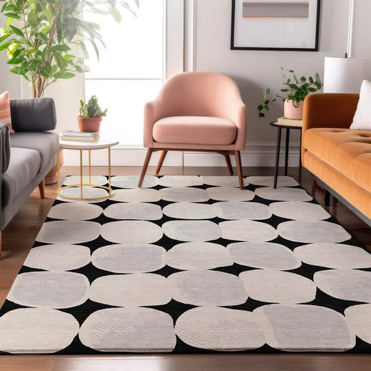 5' X 8' Black And Ivory Abstract Geometric Washable Area Rug With UV Protection