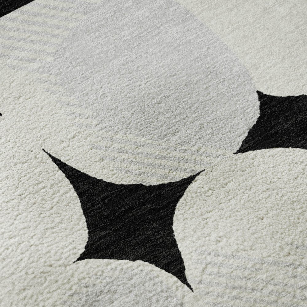 8' X 10' Black And Ivory Abstract Geometric Washable Area Rug With UV Protection