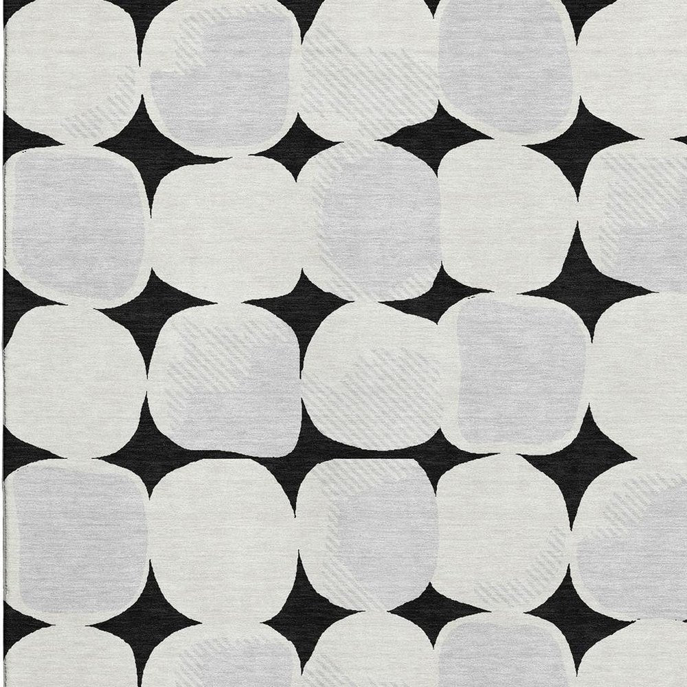 8' X 10' Black And Ivory Abstract Geometric Washable Area Rug With UV Protection