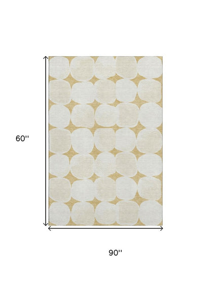 5' X 8' Gold And Ivory Abstract Geometric Washable Area Rug With UV Protection