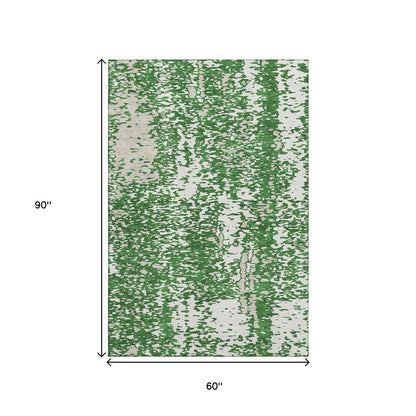 5' X 8' Emerald And Ivory Abstract Washable Area Rug With UV Protection