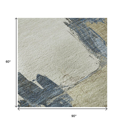 5' X 8' Beige Blue And Ivory Abstract Washable Area Rug With UV Protection