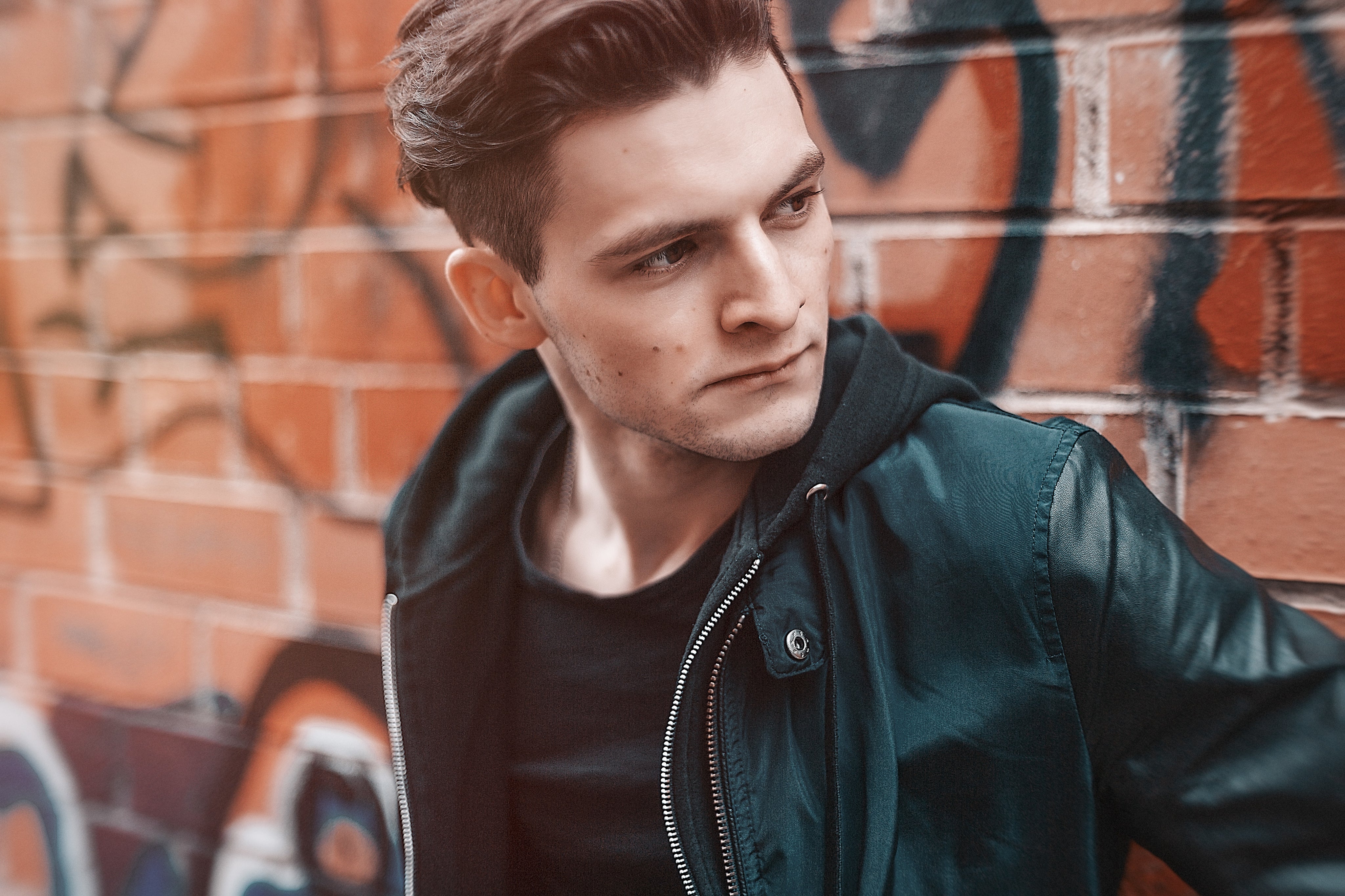files/man-in-leather-graffiti-bricks.jpeg